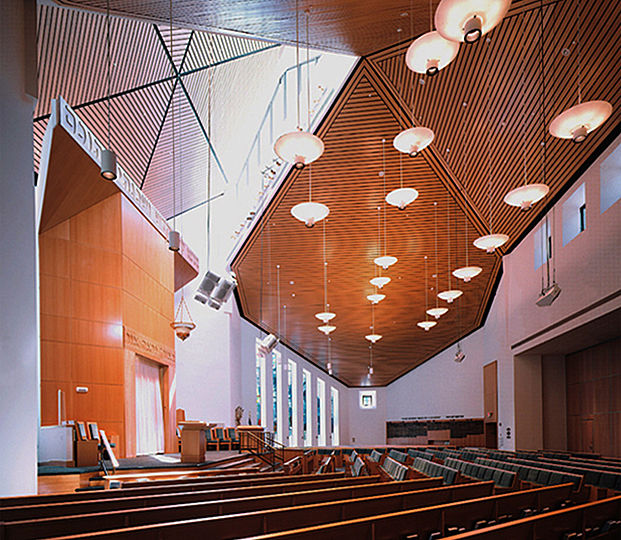 The pendant fixture type which illuminates the 40-foot high Main Hall is a custom assembly of a standard cylindrical down-light and a 30-inch diameter decorative diffuser. The diffuser also contains up-lights to illuminate the wood-paneled ceiling.