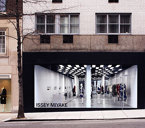 The storefront glass panel of Miyakeâ€™s Madison showroom spans the entire 26-foot wide exterior wall, visually opening the storeâ€™s interior to the street. The syncopated rhythm of alternating fluorescent light-boxes and black voids of exposed ceiling sets up an "op-art" plane - provoking the attention of passers-by. 