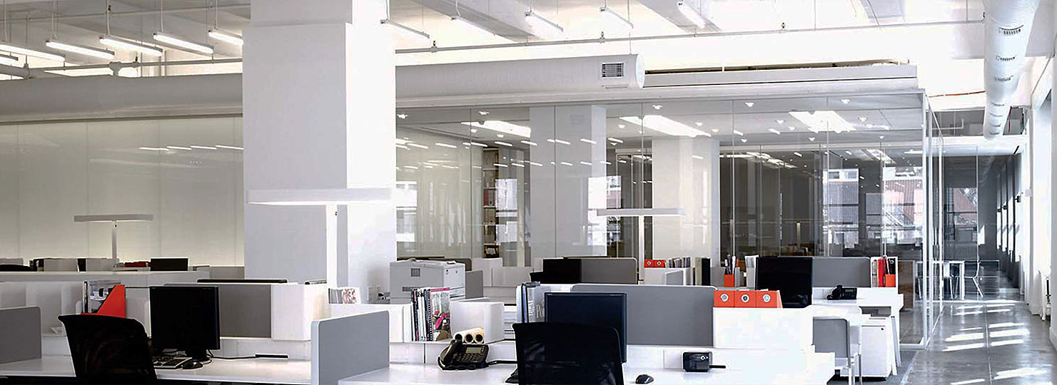 The â€œoutdoorâ€ open space of the design studio is illuminated by the canopy-resembling rows of bare T6 fluorescent channels, suspended over the studiosâ€™ common areas. 