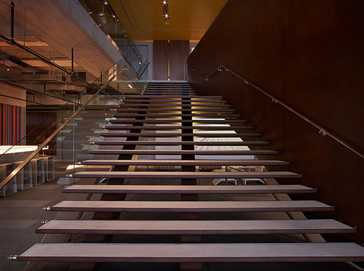 The centerpiece of the headquarters is its asymmetrical stairway, which double-functions as an amphitheater with seating for staff meetings.